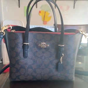 Black and brown coach purse